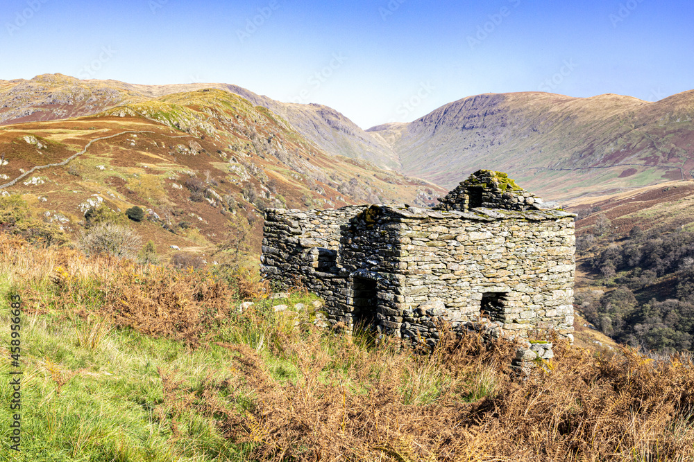 An old abandond barn or bothy on the hills beside the Kirkstone Pass near Troutbeck, Cumbria UK