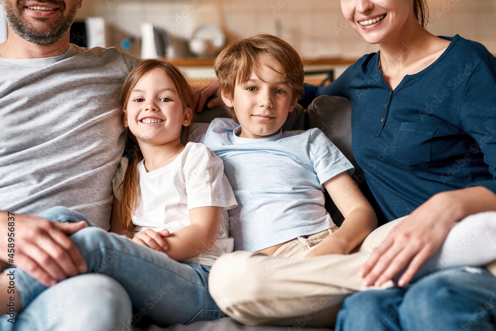 Portrait of happy teen kids relax at home with parents Portrait of happy teen kids relax at home with parents
