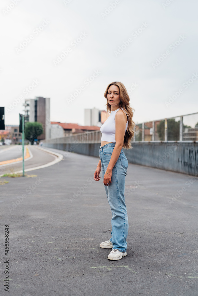 Young serious and dreamy woman outdoor looking camera posing modelling confident and healthy