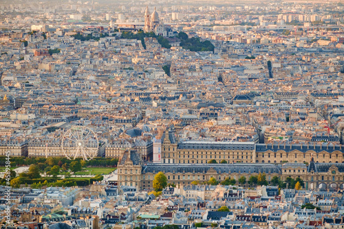 Aerial view of Paris, including the Louvre museum and Montmartre Cathedral. photo