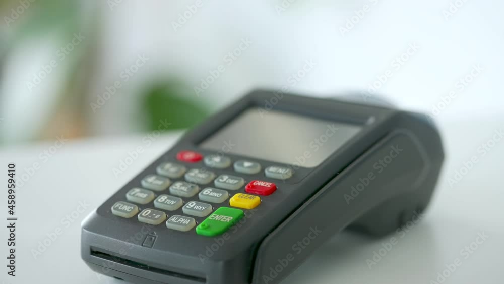 Contactless payment with smartphone. Wireless payment concept. Close-up, woman using smartphone cashless wallet NFC technology to pay order on bank terminal. Contactless payment with smartphone. Wireless payment concept. Close-up, woman using smartphone cashless wallet NFC technology to pay order on bank terminal.