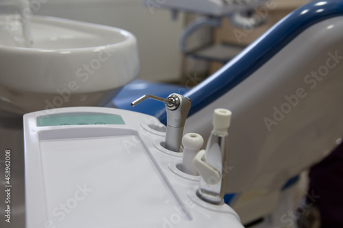 Dental sink. Which is in the dental chair.