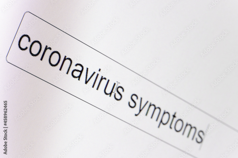 Search bar on a computer monitor with the question Coronavirus symptoms. Searching for information on the Internet, close up. Search bar on a computer monitor with the question Coronavirus symptoms. Searching for information on the Internet, close up.