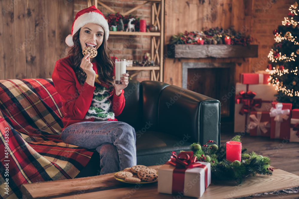 Fototapeta premium Photo of millennial nice brunette lady sit eat wear red sweater hat jeans at home alone