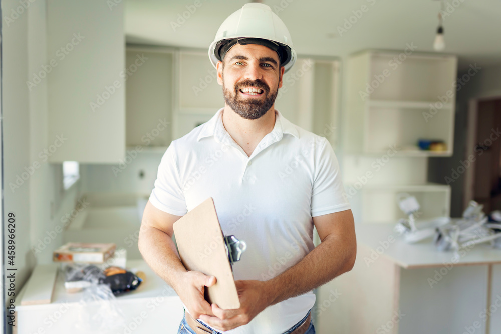 man with a white hard hat holding a clipboard, inspect house man with a white hard hat holding a clipboard, inspect house
