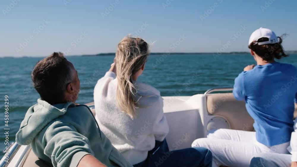Young european tourists, men and women celebrate on a yacht a happy start to their vacation - a group of friends enjoying a seaside vacation Young european tourists, men and women celebrate on a yacht a happy start to their vacation - a group of friends enjoying a seaside vacation