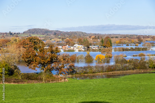 The Yew Tree Inn surrounded by floodwater from the River Severn filling the fields around the Severn Vale village of Chaceley, Gloucestershire UK on 18/11/2019