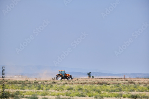 Tractor working in the harvest on a summer day in Castilla la Mancha