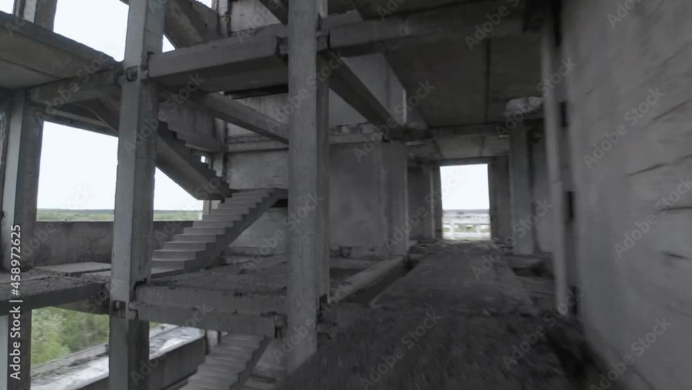 FPV drone flies fast and maneuverable inside an abandoned building. Post-apocalyptic location without people FPV drone flies fast and maneuverable inside an abandoned building. Post-apocalyptic location without people