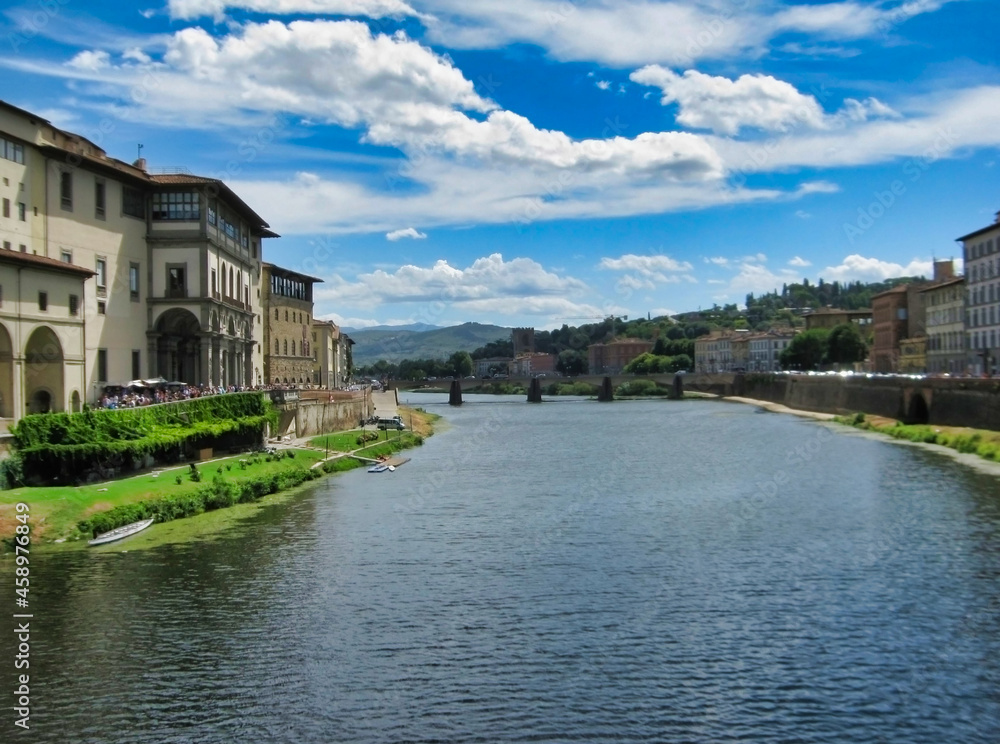 Arno river in the city of Florence. Historic houses and bridge. Tuscany. Italy. Europe