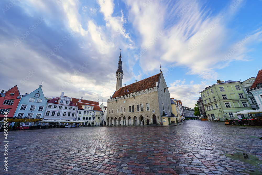 Main square with medieval buildings at sunrise after raining. Tallinn Estonia.