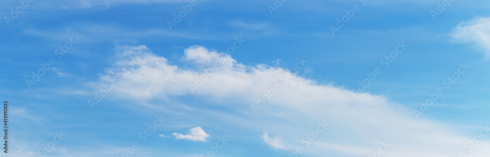 White clouds of indefinite shape in the blue sky