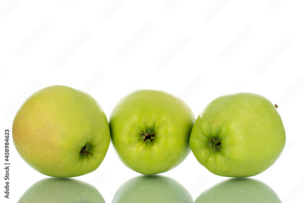 Three ripe green apples , close-up, isolated on white. Three ripe green apples , close-up, isolated on white.