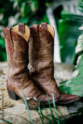 Brown cowboy boots on the green background Fancy Western Boots Vintage cowboy boots A pair of cowboy boots 