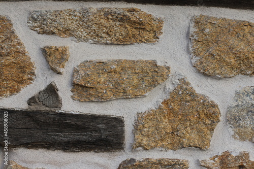 Fragment of the old facade of a house made of natural stone, Greece, Halkidiki, Arnaia photo