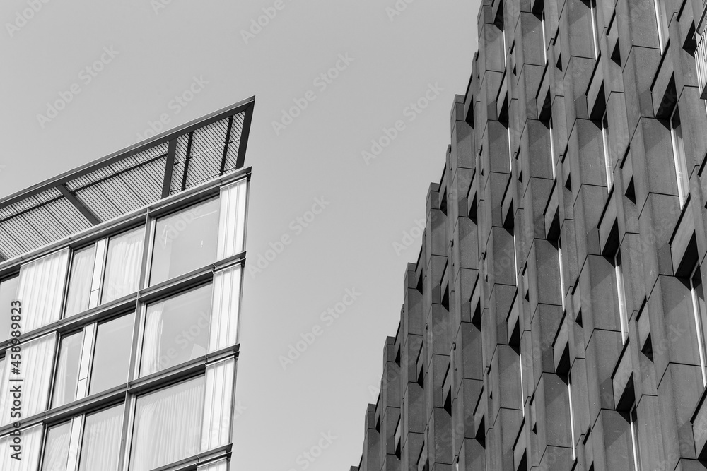 Fotografía Modern office building with windows in Amsterdam, Netherlands (black and white p