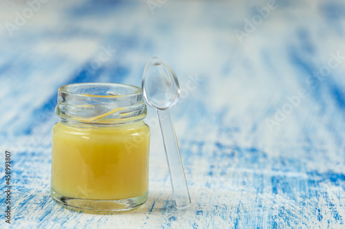 Photos Raw organic royal jelly in a small bottle ,royal jelly