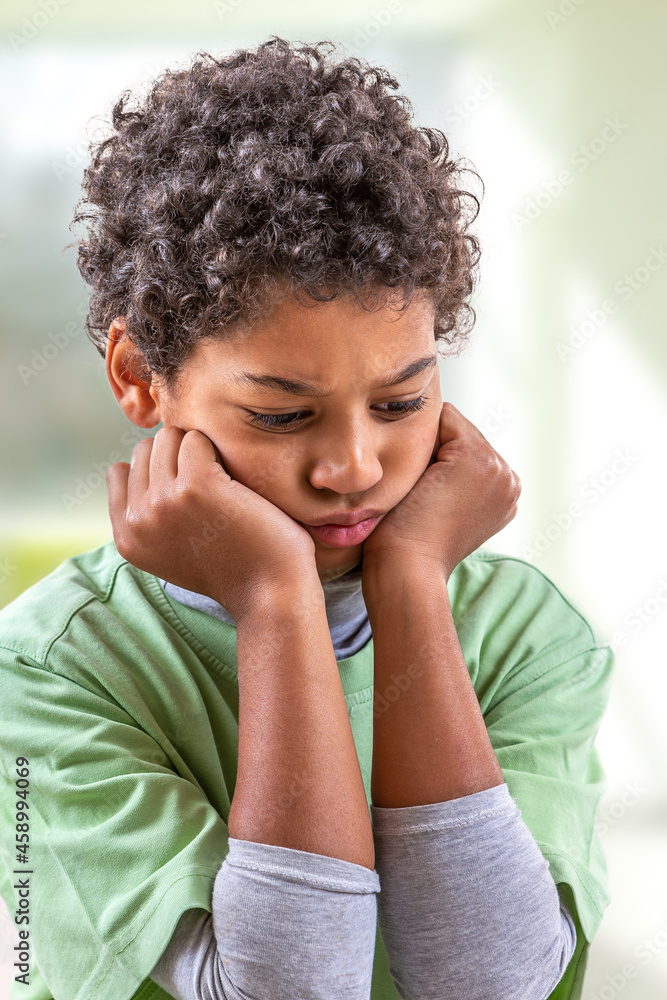 Upset problem child with head in hands for bullying, depression stress or frustration. Upset problem child with head in hands for bullying, depression stress or frustration.