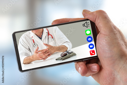 Hand of a man holding Smartphone, mobile phone with calling icon in here,phone ,song,camera,and messaging,and live chat ith doctor on screen on white backgroud. photo