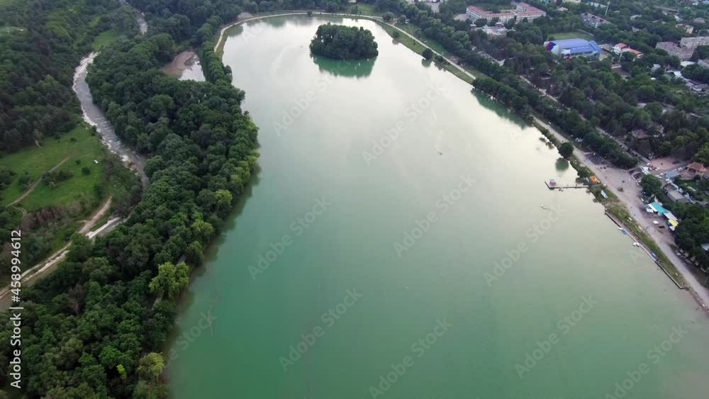 Quadcopter flies to an artificial lake in the woods and a turbulent mountain river Quadcopter flies to an artificial lake in the woods and a turbulent mountain river