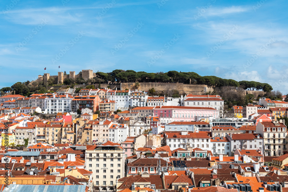 Building facades in the center of Lisbon fill the urban scene with historic and traditional architecture.