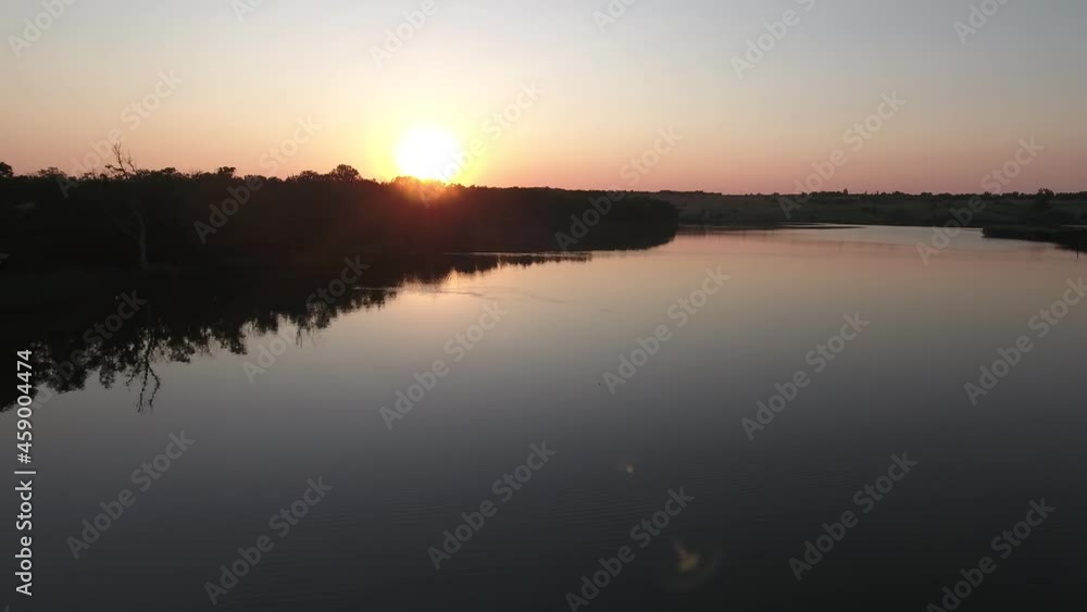 Sunset over the lake. Reflection in the water. Sunset over the lake. Reflection in the water.