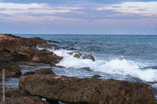waves crashing on rocks © adrian