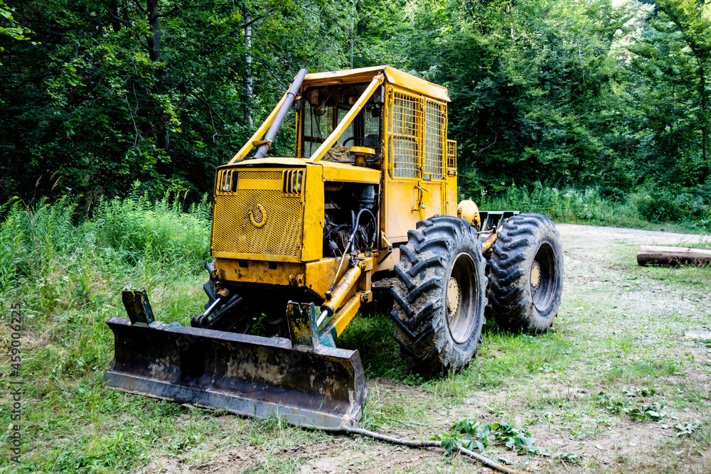 Forest tractor for logging after sawing trees, heavy forestry equipment Forest tractor for logging after sawing trees, heavy forestry equipment