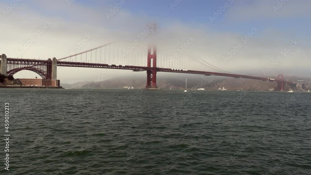 A Time Lapse of the Golden Gate Bridge, San Francisco, California, at 8X Speed as Fog Rolls in and out of the Scene through the Tower Structures A Time Lapse of the Golden Gate Bridge, San Francisco, California, at 8X Speed as Fog Rolls in and out of the Scene through the Tower Structures