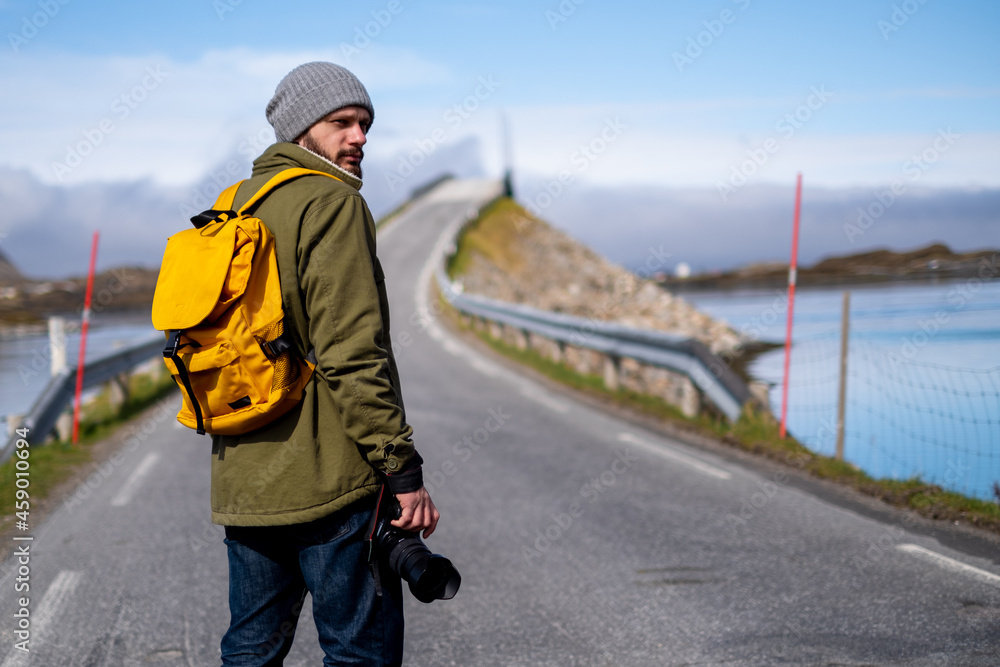 Traveler photographer beautiful long Norwegian road Traveler photographer beautiful long Norwegian road