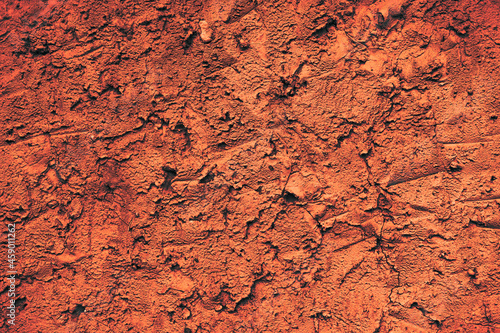 Obraz na plátně Uneven surface of orange color, abstract background