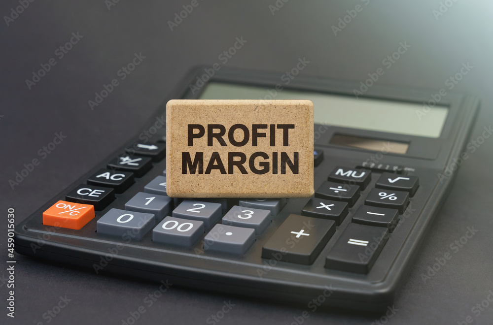 There is a sign on the calculator that says - PROFIT MARGIN There is a sign on the calculator that says - PROFIT MARGIN