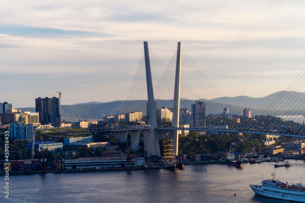 Naklejka premium Urban landscape with a view of the Golden Bridge. Vladivostok, Russia
