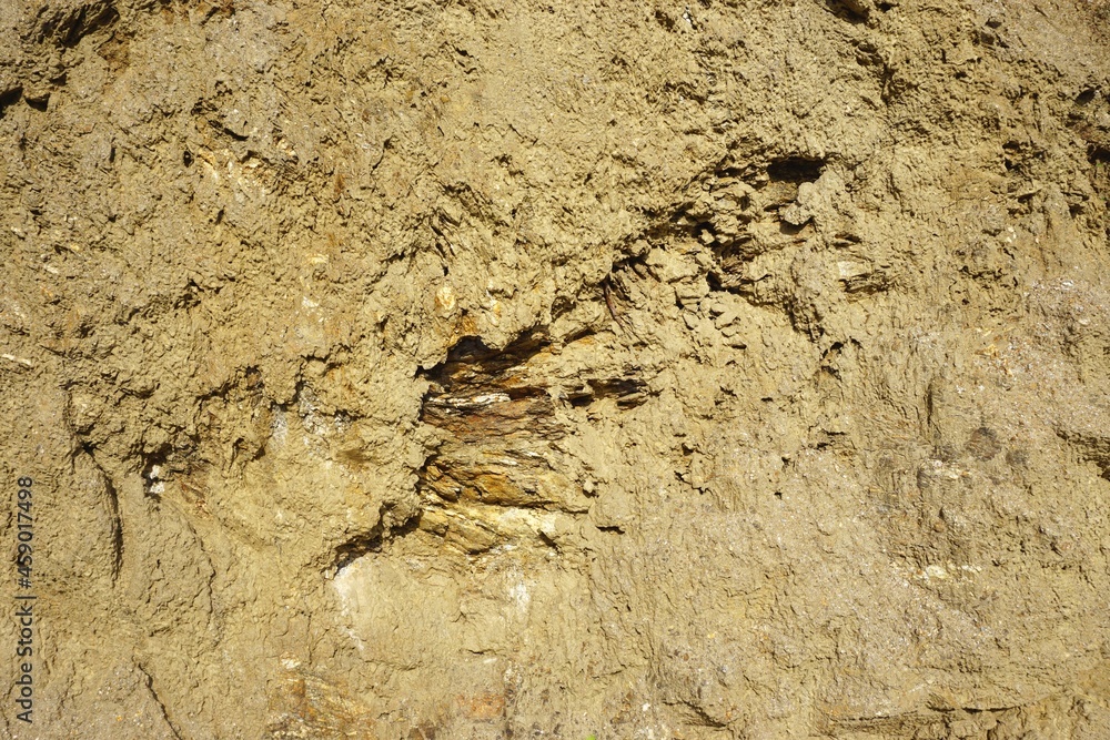 Closeup view of crumbling dirt pile with sand, grit and soil natural horizontal abstract background texture