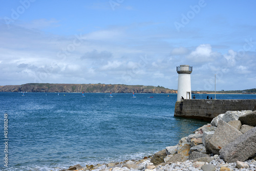 Camaret sur Mer, France, little light tower at the port entry, view to the brittany coast photo