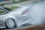 Highspeed drifting done by a professional at a race track 