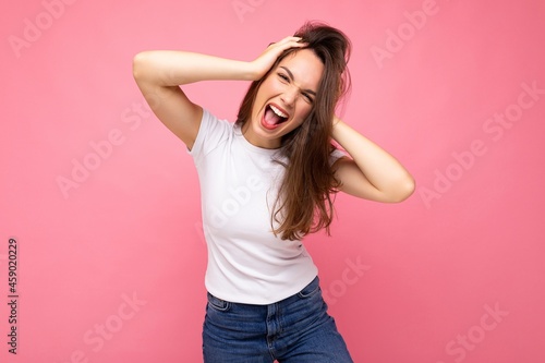 Photo shot of cute nice charming gorgeous attractive pretty youngster emotional and crazy woman wearing white t-shirt for mockup isolated over colorful background with copy space © Ivan Traimak