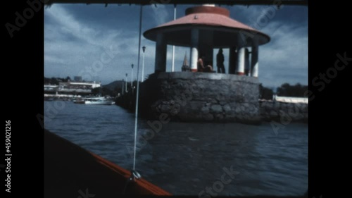 Lake Chapala Pier 1975 - A boat arrives at Muelle de Lago de Chapala, the Lake Chapala Pier, in the town of Chapala on Lake Chapala in Jalisco, Mexico in 1979. photo