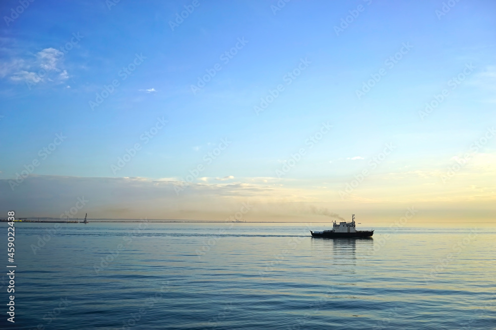 Seascape with a ship on the horizon