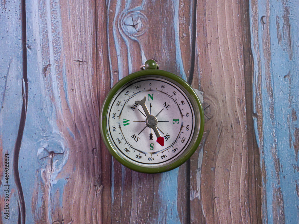 compass on wood table for tourist or travel concept compass on wood table for tourist or travel concept