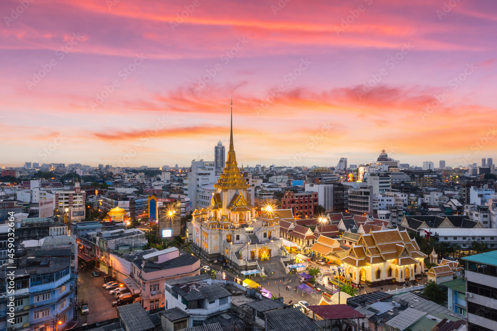Top views Wat Traimit Withayaram Worawihan with beautiful sunset background, Bangkok