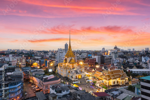 Top views Wat Traimit Withayaram Worawihan with beautiful sunset background, Bangkok
