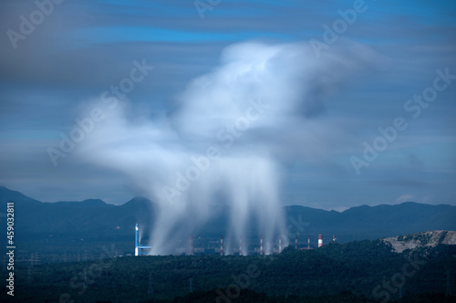 Aerial view coal power plant station and steam in the morning mist, Mae Moh, Lampang, Thailand. Long exposure.