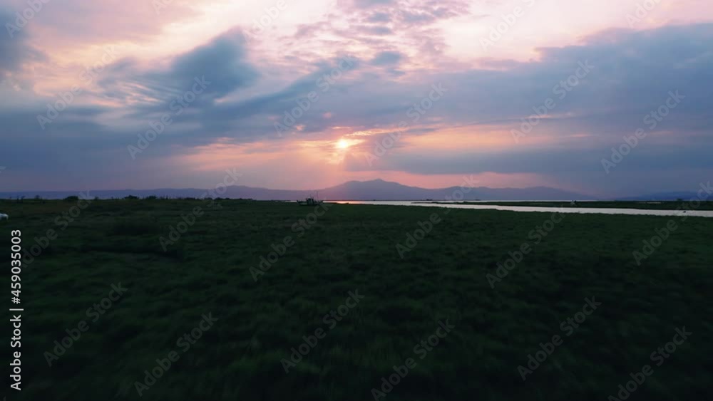 Sunrise at national park of Delta Axios in Greece, drone flying forward footage. Sunrise at national park of Delta Axios in Greece, drone flying forward footage.