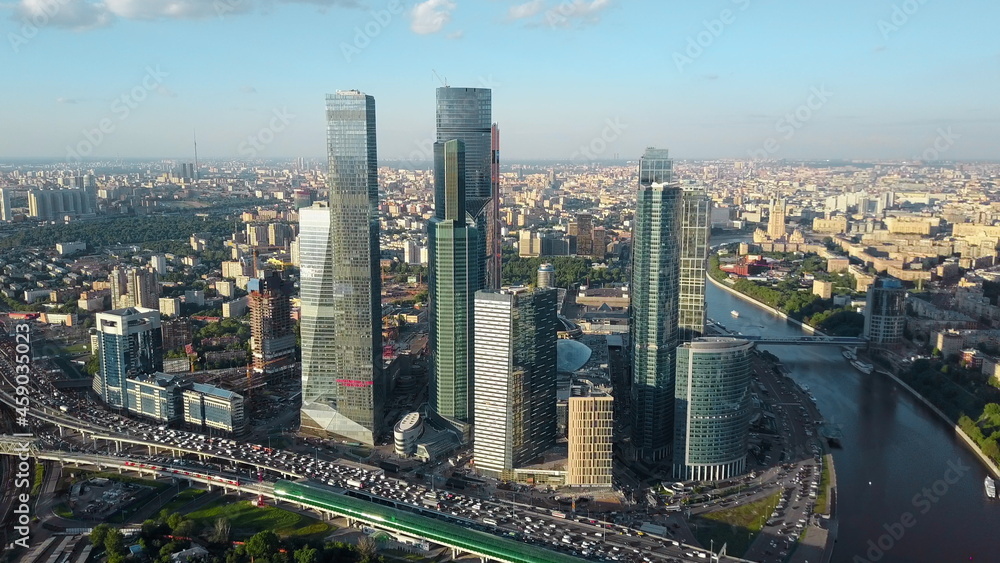 Fototapeta premium Aerial Moscow cityscape with business centre, river and heavy traffic