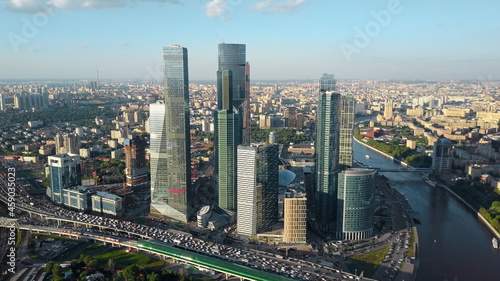Aerial Moscow cityscape with business centre, river and heavy traffic
