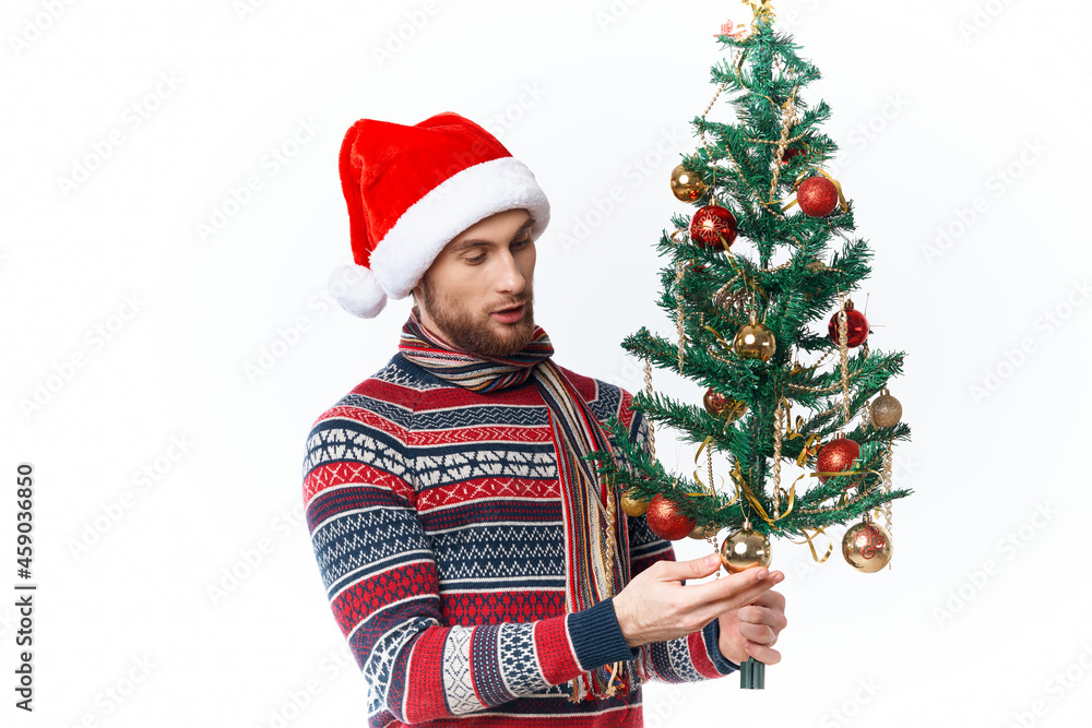emotional man in a santa hat Christmas decorations holiday New Year studio posing emotional man in a santa hat Christmas decorations holiday New Year studio posing