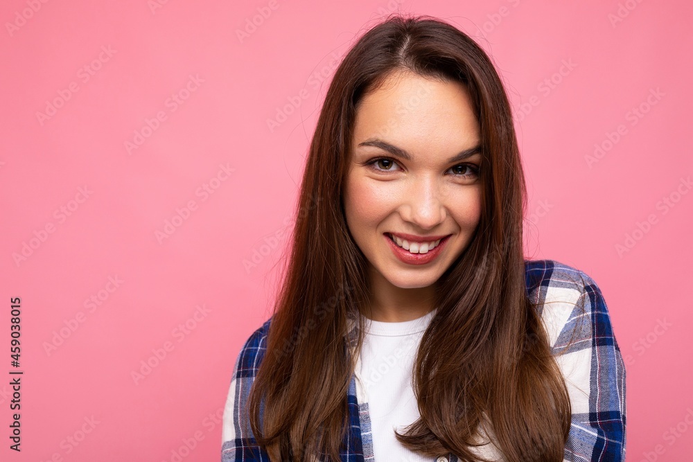 Portrait of positive cheerful fashionable woman in hipster outfit isolated on pink background with copy space Portrait of positive cheerful fashionable woman in hipster outfit isolated on pink background with copy space