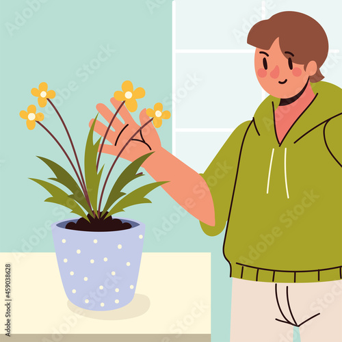 young man and houseplant care