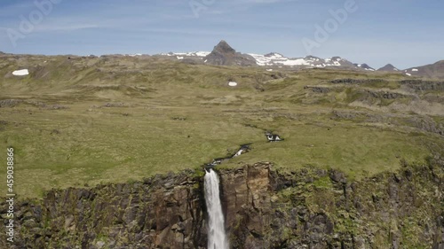 Aerial crane scene. Rising above the crest of Bjarnafoss Waterfall to reveal the rugged terrain beyond. photo